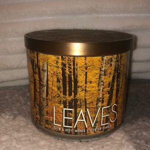 Used Bath & Body Works Leaves 3-wick candle.